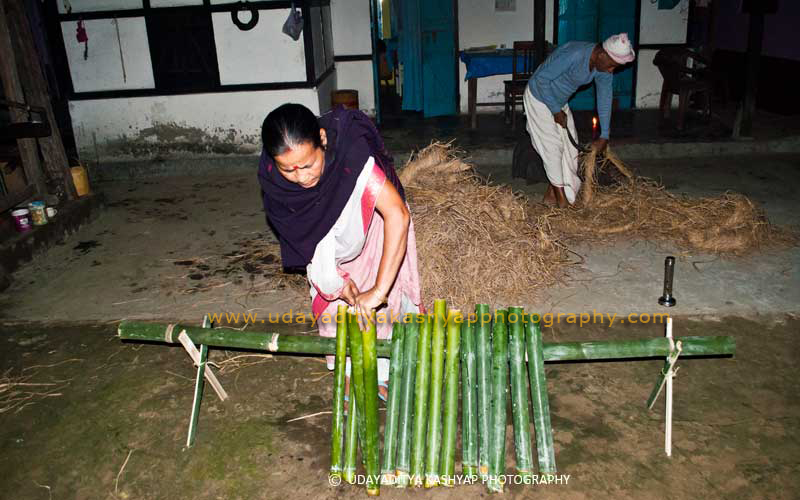 Getting ready to burn the bamboo tubes